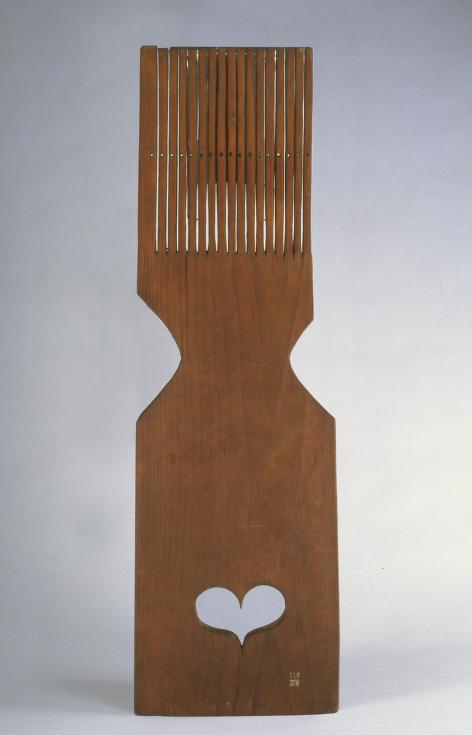 wooden tape loom with heart carved at bottom